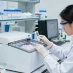 Researcher examining lyophilisation peptides in a lab freezer at -20 °C, ensuring optimal storage conditions.